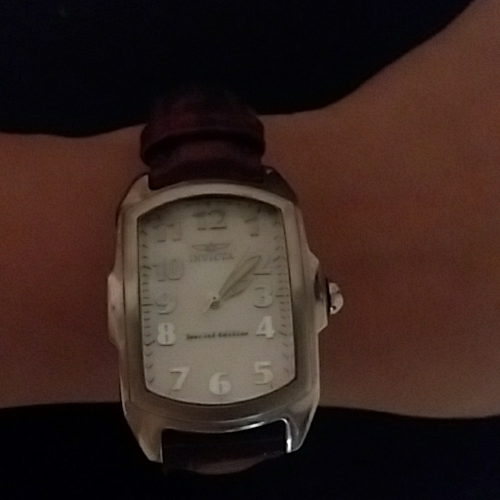 Invicta watch with various colored bands